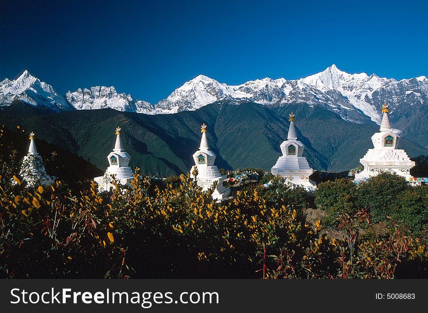 A row of Stupas in front of the snow mountain.
- Meili Snow Mountains, Deqin of Yunnan Province, China.