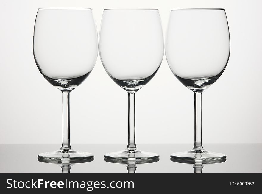 Three wineglasses on white background. Three wineglasses on white background