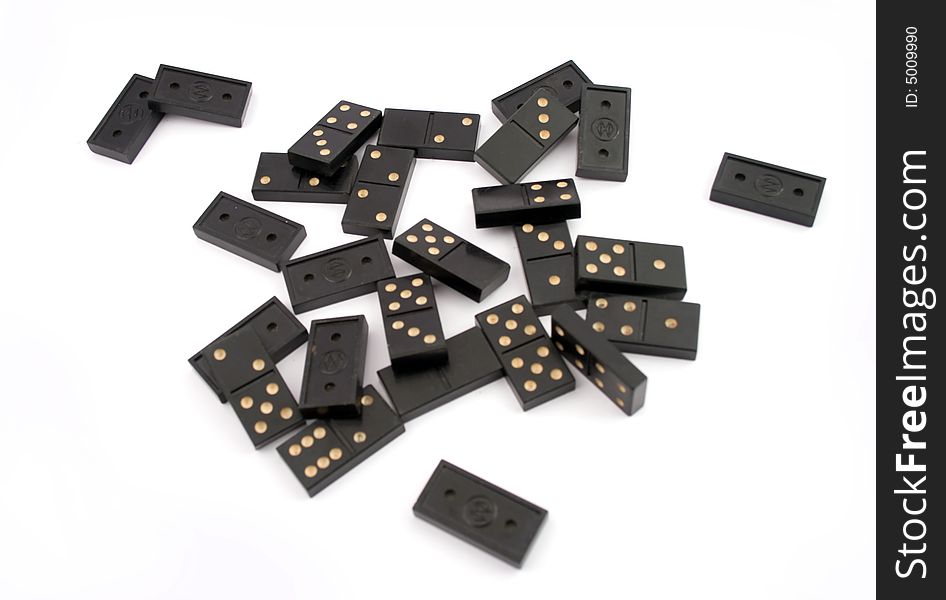 The black domino is chaotically scattered on a white background. The black domino is chaotically scattered on a white background