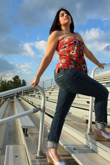 Woman On Bleachers Stock Image Woman On Bleachers Stock Image