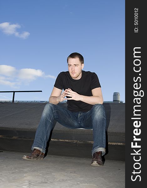 Portrait of a handsome young man on the roof. Portrait of a handsome young man on the roof