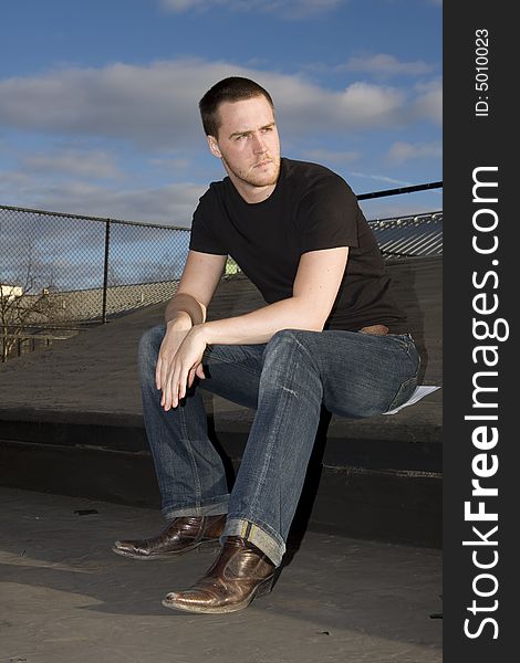 Portrait of a handsome young man on the roof. Portrait of a handsome young man on the roof