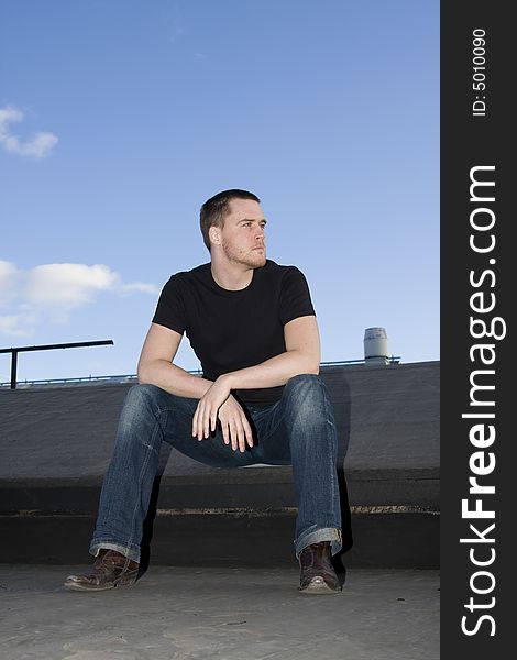 Portrait of a handsome young man on the roof. Portrait of a handsome young man on the roof