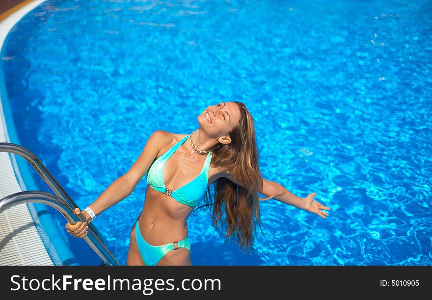 Attractive woman in the pool. Attractive woman in the pool