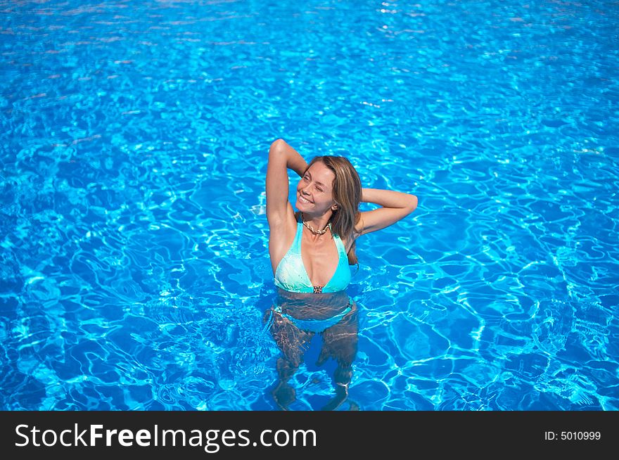Attractive woman in the pool. Attractive woman in the pool