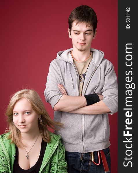 The young girl and the guy on a red background. The young girl and the guy on a red background.