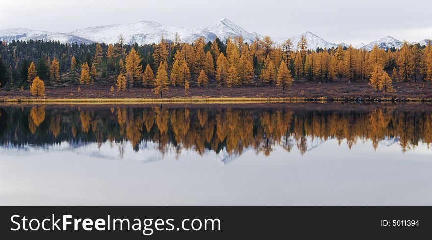 Lake in mountain valley. Photo.