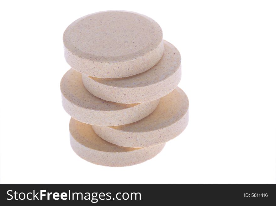 Stacked soluble vitamin pills on white. Stacked soluble vitamin pills on white