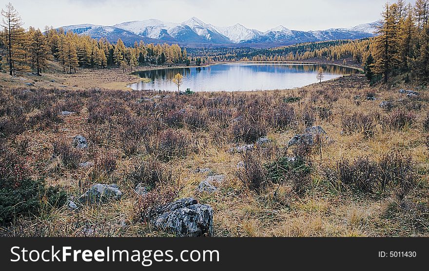 Lake in mountain valley. Photo.