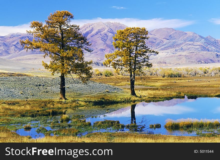 Lake in mountain valley. Photo.