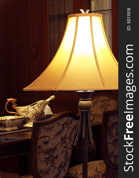 Antique floor lamp in the Western-style dining-room of the Chinese family.