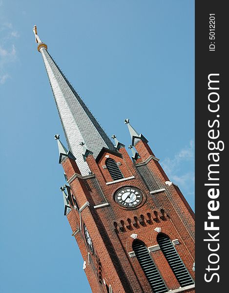 A clock tower belonging to a church. A clock tower belonging to a church.