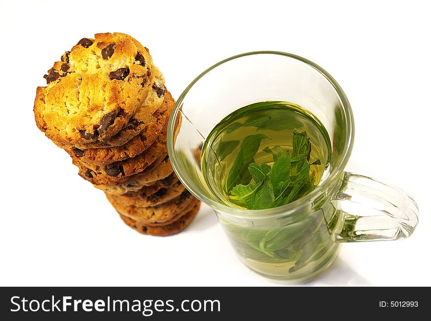 Cookies with chocolate and mint tea isolated. Cookies with chocolate and mint tea isolated