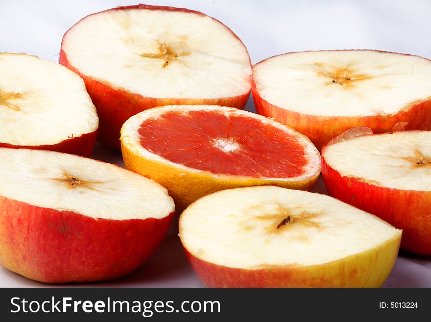 An orange and some apples