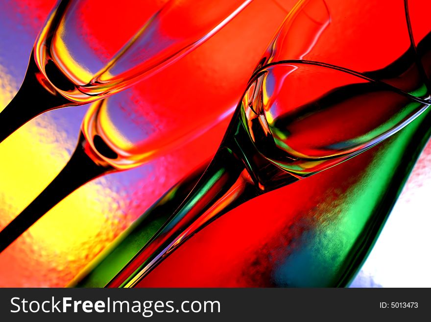 Abstract background design made from wine glasses and a bottle and numerous colors.
