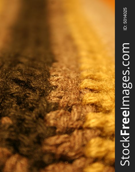Close up photo of a woolen scarf showing the fibres of the material. Close up photo of a woolen scarf showing the fibres of the material