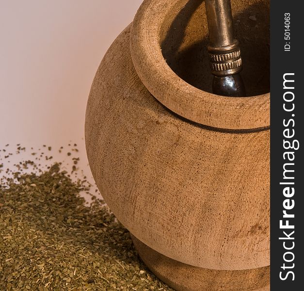 Photo of a mate, yerba and a bombilla. This drik is usually consumed in south america and is a sort of tea. Photo of a mate, yerba and a bombilla. This drik is usually consumed in south america and is a sort of tea