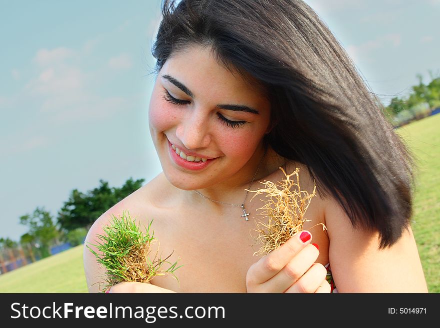 Woman Holding Grass Patches