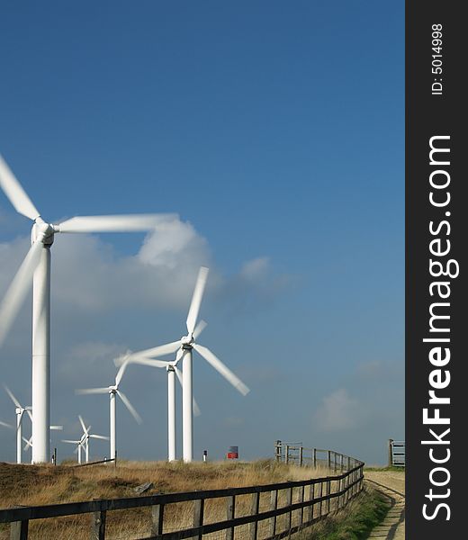 Photo of electricity wind turbines producing eco friendly energy