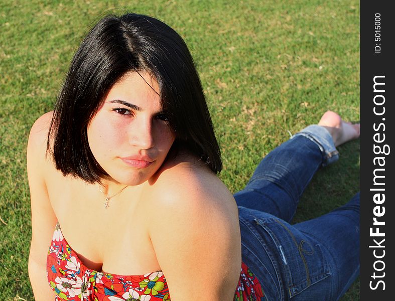 Woman stretching on the grass.