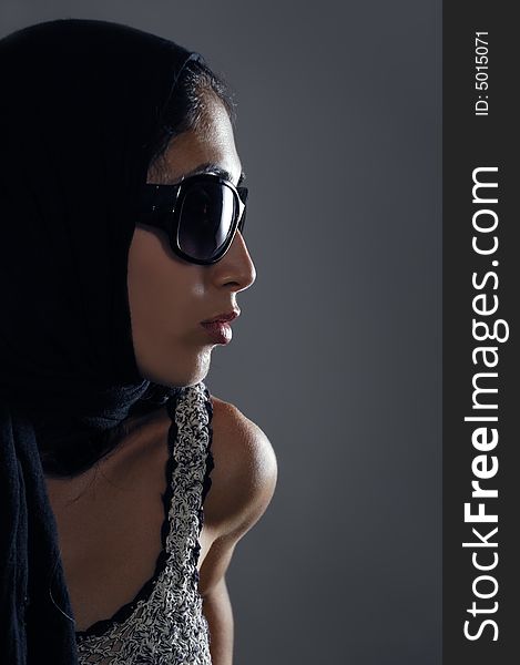 Portrait of sophisticated female wearing black fashion sunglasses