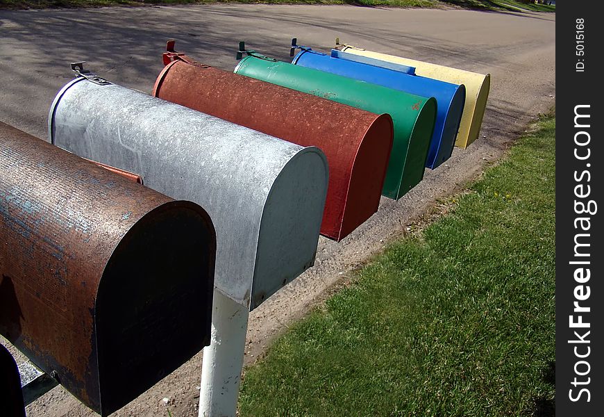 Colorfully painted residential mailboxes in small town in the rural Midwest. Colorfully painted residential mailboxes in small town in the rural Midwest