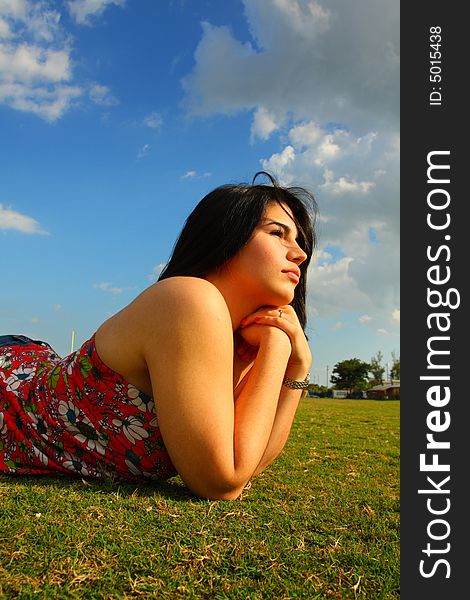 Attractive woman enjoying nature and laying on grass. Attractive woman enjoying nature and laying on grass.