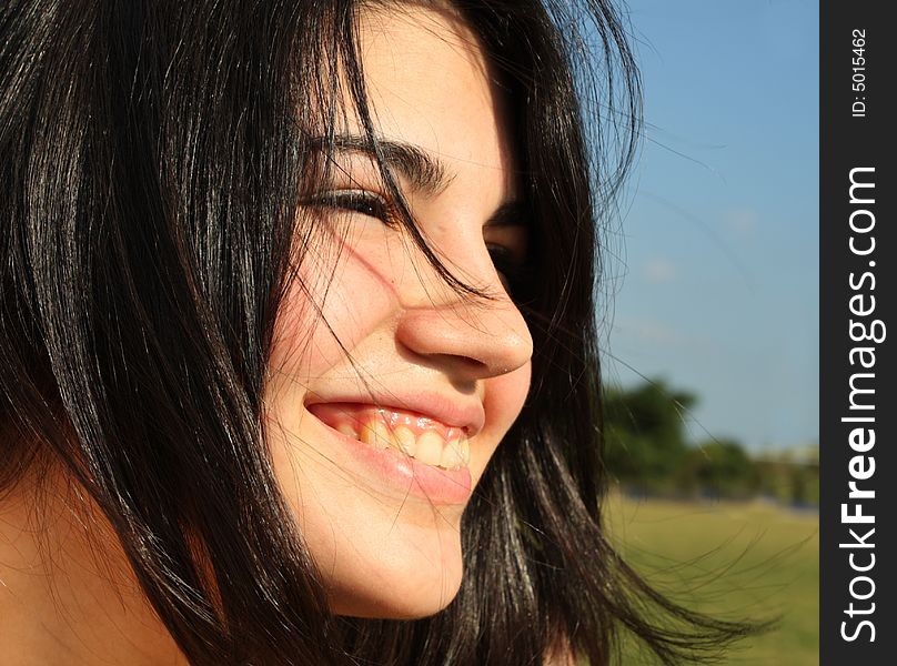 Headshot of a pretty young woman smiling. Headshot of a pretty young woman smiling.