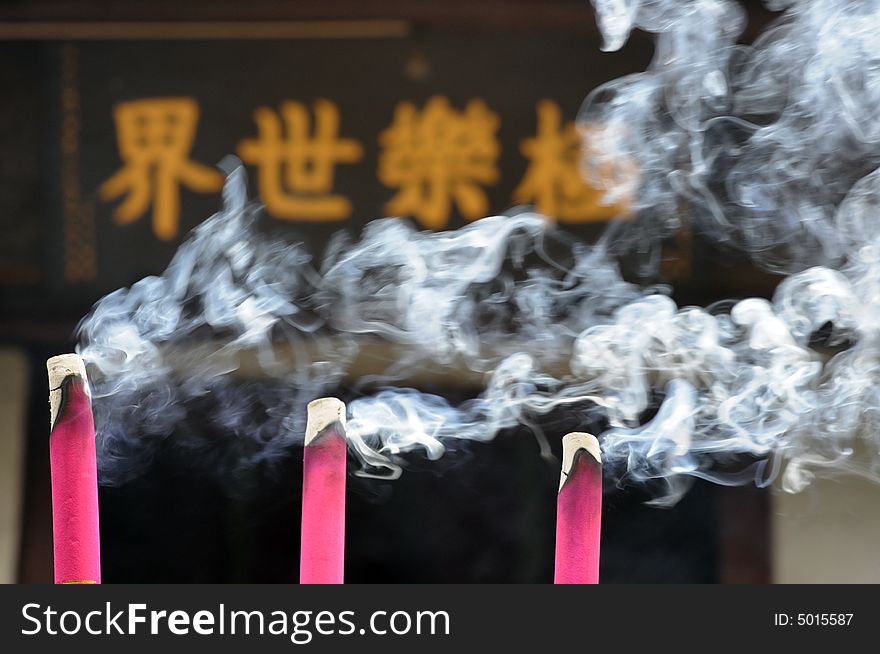The burnning three incense sticks in a temple. The burnning three incense sticks in a temple.