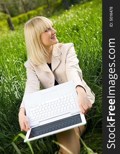 Young pretty businesswoman with laptop. Young pretty businesswoman with laptop