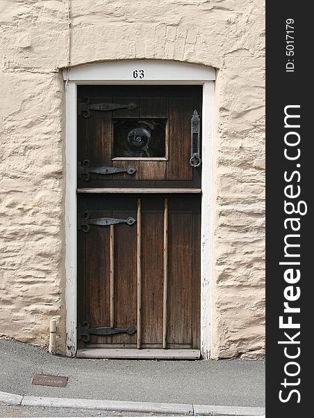 An old wooden cottage door. An old wooden cottage door