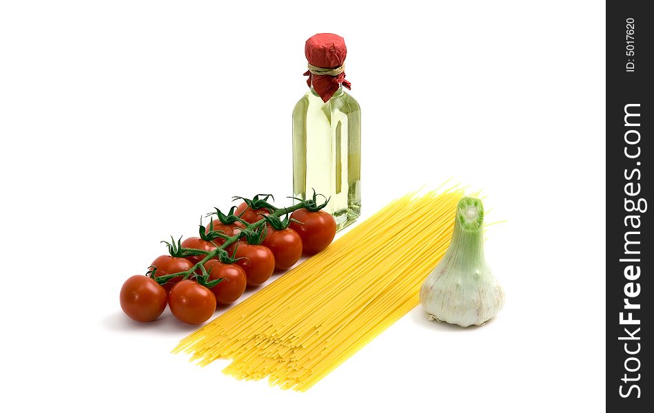 Spaghetti, tomatoes,garlic and olive oil isolated on white. Spaghetti, tomatoes,garlic and olive oil isolated on white.