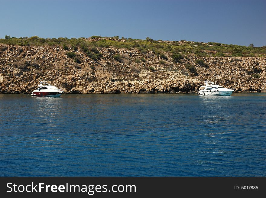 Boats on Mediterranean sea at Cape Greko, sunny day of Cyprus.