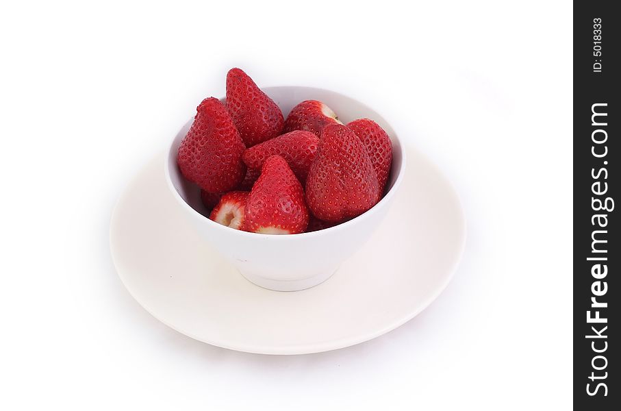 Red fresh and tasty strawberries in white bowl on white background