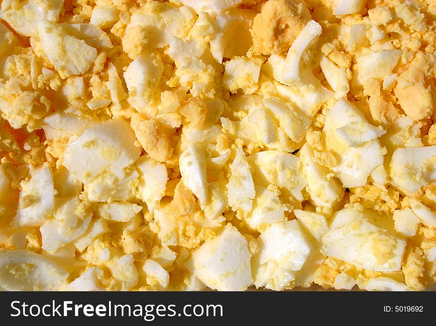 Abstract background close up photo of chopped eggs. Abstract background close up photo of chopped eggs