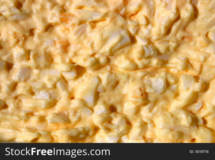 Abstract background close up photo of chopped eggs with mayonnaise. Abstract background close up photo of chopped eggs with mayonnaise