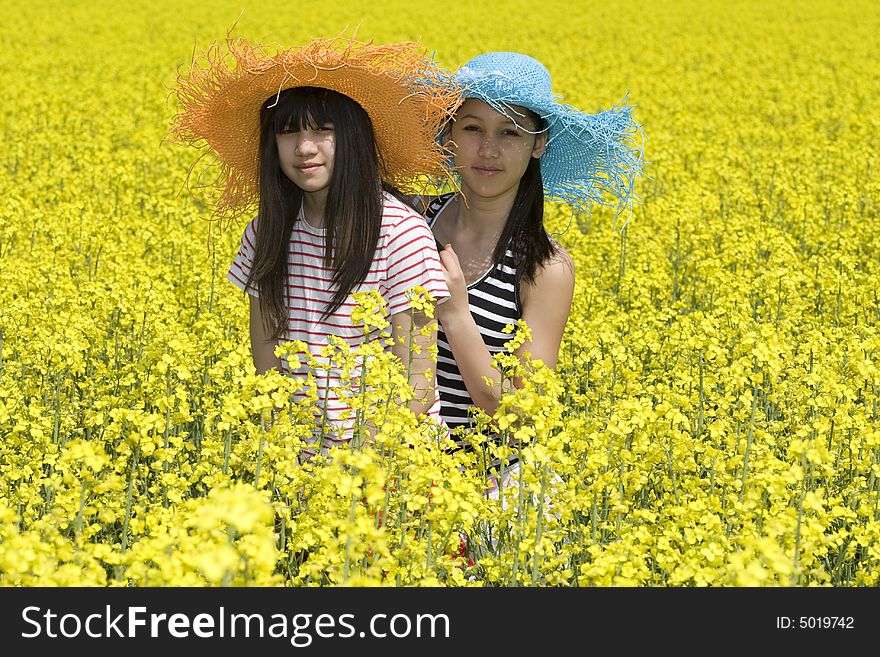 Teenagers in the rape field photographed at spring time