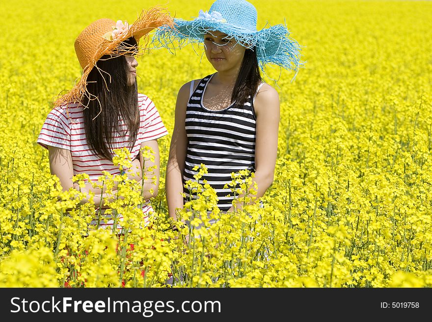 Teenagers in the rape field photographed at spring time