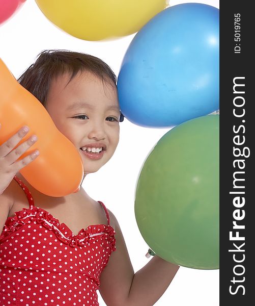 Young little toddler with the colorful balloons