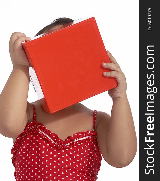 Young child on red top holding a red box