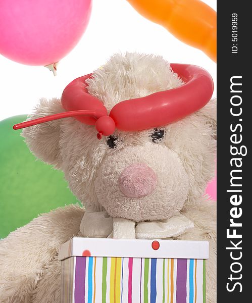 Teddy bear and the balloons over a white background