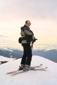 Skier On Peak Of The Mountain Royalty Free Stock Photo
