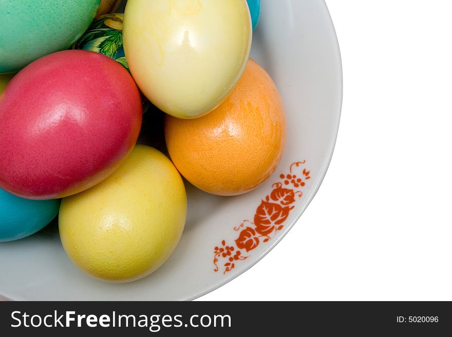 Colored easter eggs on the plate white isolated