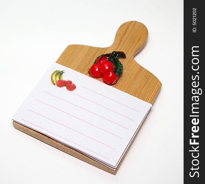 A kitchen board with paper for notes