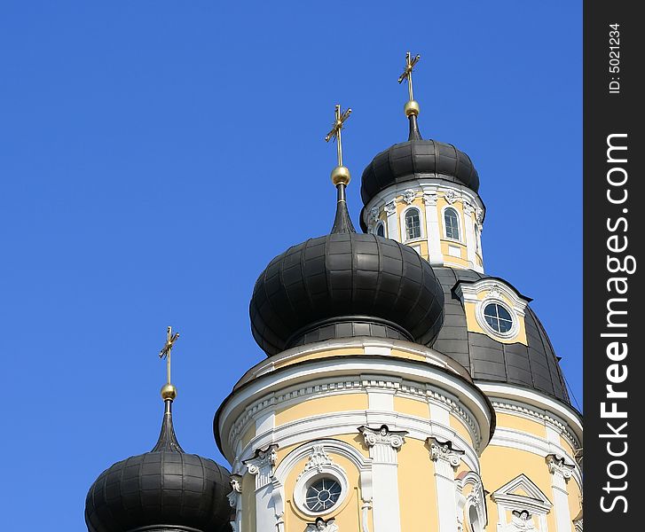 Domes of orthodox church on a blue sky background. St.Petersburg, Russia