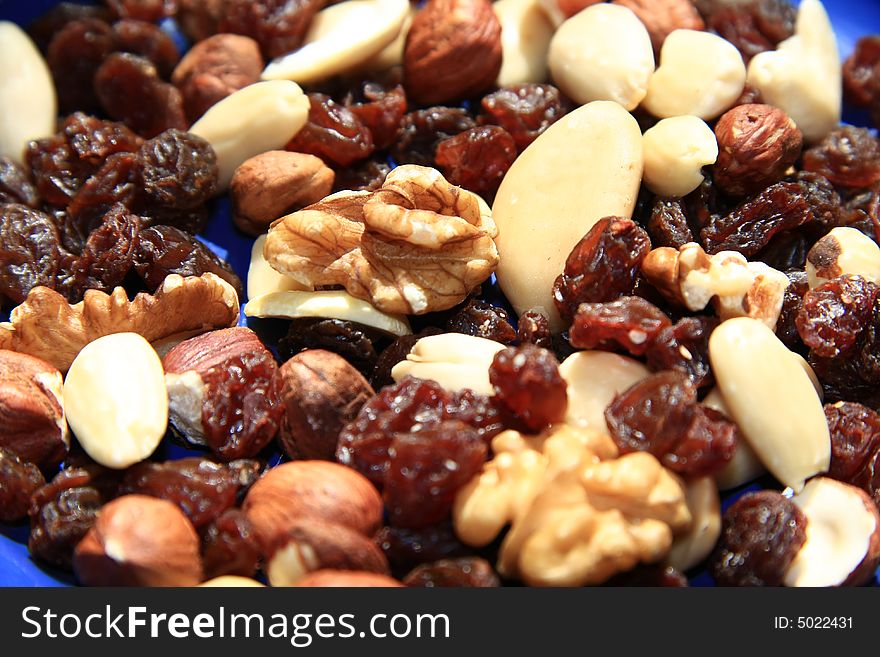 A mix of nuts and raisins. A mix of nuts and raisins