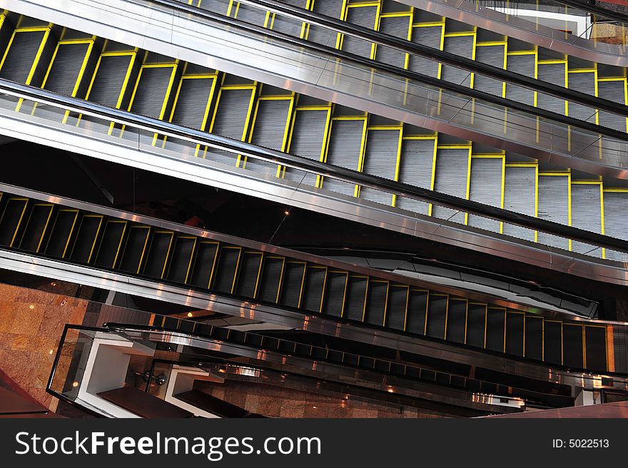 Multiple layers of escalators in a shopping center.