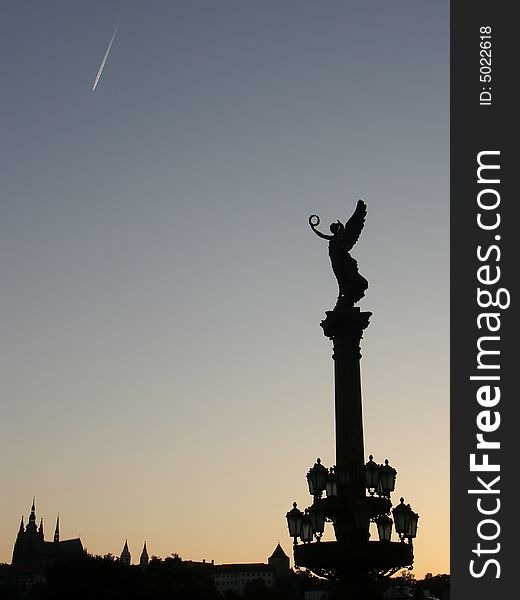 Silhouette of Muse statue and Prague castle. Silhouette of Muse statue and Prague castle.