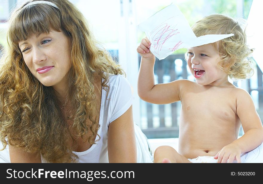 High key portrait of happy mother with baby. High key portrait of happy mother with baby