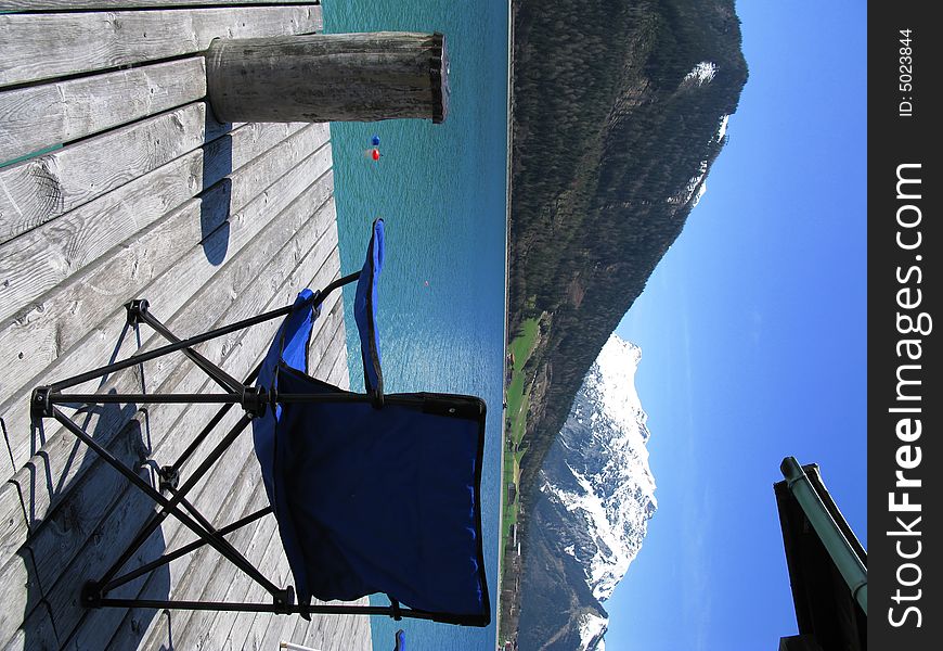 Blue chair on a lake